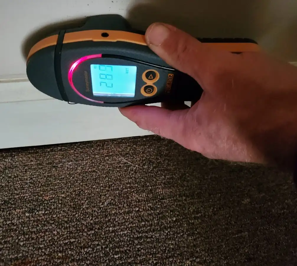 Moisture detection at baseboard during Burst Pipe Cleanup in Cumming